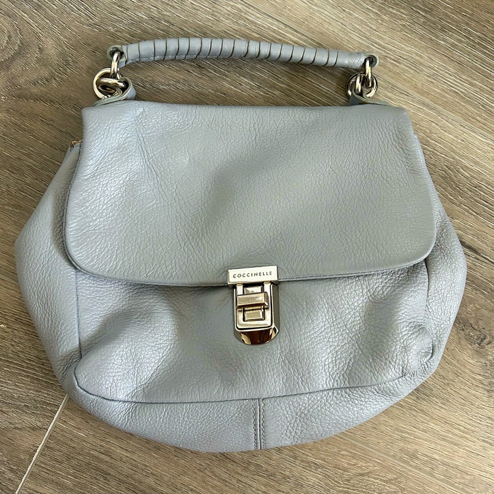 Coccinelle leather purse. Light blue, adjustable strap to wear cross body